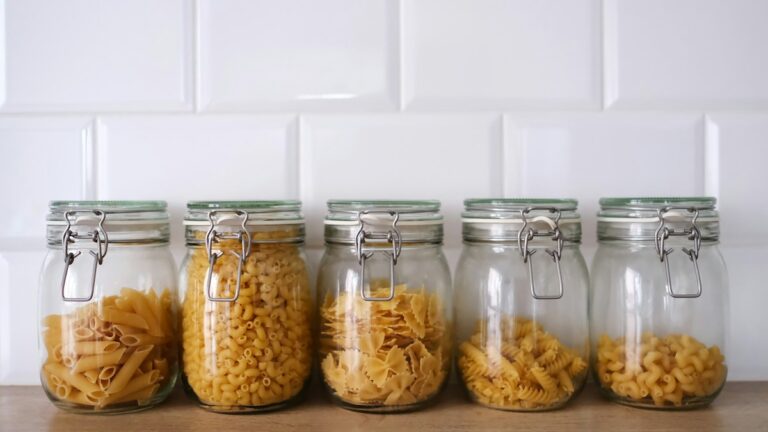 Angled acrylic drawer trays, uniform 4oz glass jars, and waterproof minimalist l